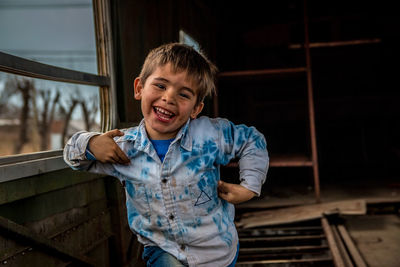 Portrait of smiling boy standing outdoors