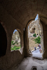 People seen through archway