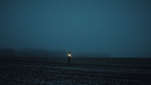 Scenic view of field against sky at night