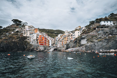 Wide angle shot of riomaggiore's harbor famous italian coastal village