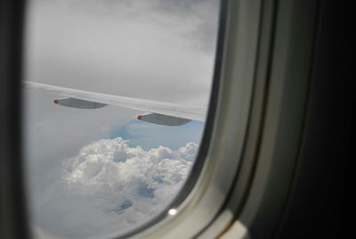 Close-up of airplane wing seen through window