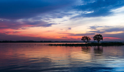 Scenic view of lake against sky during sunset