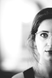 Close-up portrait of young woman wearing eyeglasses