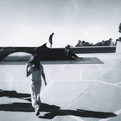 Full length of woman standing by railing