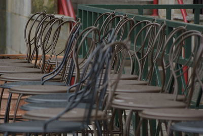Empty chairs at sidewalk cafe