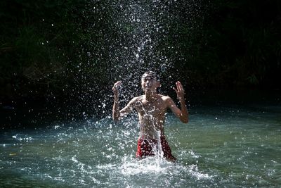 Boy swimming in pool