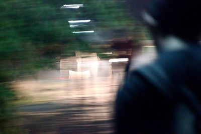 Rear view of man walking in corridor