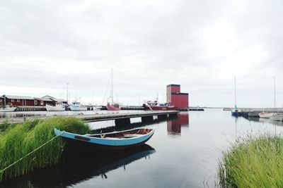 Boats moored at harbor