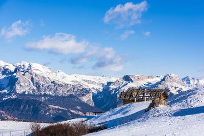 Views and huts in the snow. alpe di siusi. italy