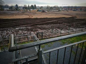 High angle view of railroad tracks on field