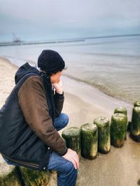 Woman looking at sea shore