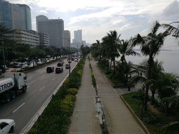 Road in city against sky