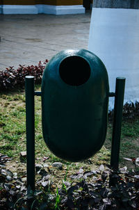 Close-up of rusty metal on field