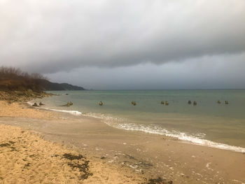 Scenic view of beach against sky