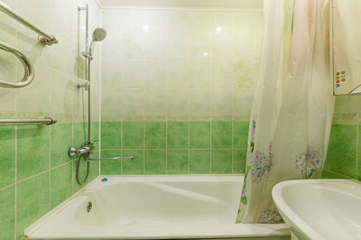 View of illuminated bathroom at home