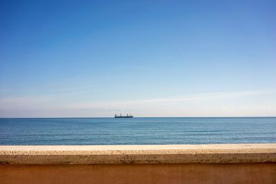 Scenic view of sea against blue sky