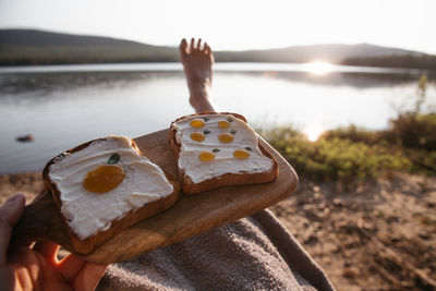 Cropped hand of woman holding ice cream cone