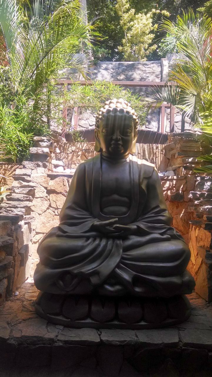 REAR VIEW OF A BUDDHA STATUE