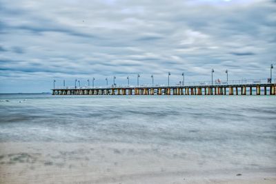 Pier over sea against sky