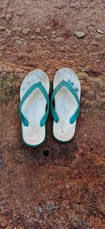 High angle view of shoes on sand