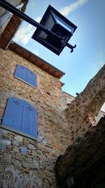 Low angle view of building against blue sky