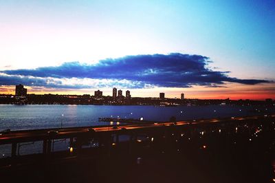 Cityscape against sky at dusk