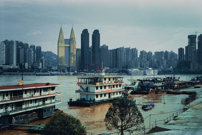 Panoramic view of buildings in city against sky