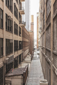 Street amidst buildings in city against sky