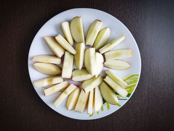 High angle view of chopped slices in plate on table