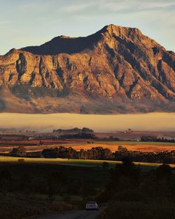 Scenic view of landscape against sky during sunset