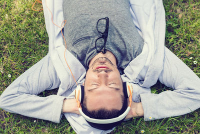 Young man sleeping on grass