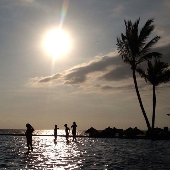 SILHOUETTE PEOPLE ENJOYING AT BEACH DURING SUNSET