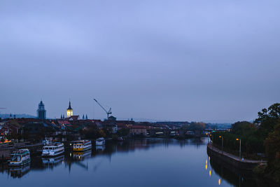 Illuminated buildings by  the river main würzburg 