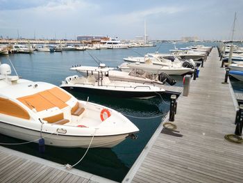 Boats moored at harbor