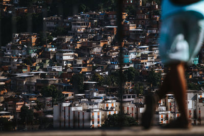 Buildings in city seen through railing