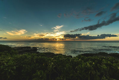 Scenic view of sea against sky at sunset