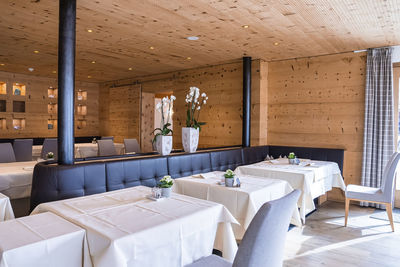Interior of elegant rustic style restaurant at luxurious ski resort
