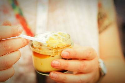 Close-up of hand holding drink