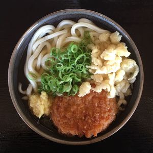 Close-up of udon noodles served on table