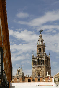 Low angle view of cathedral against cloudy sky