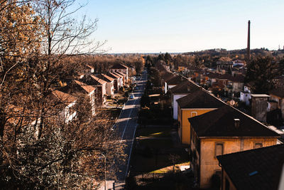 Houses in town against sky