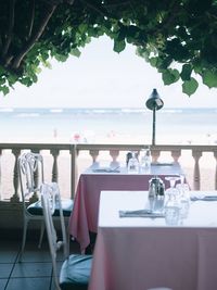 Close-up of chairs and tables at restaurant