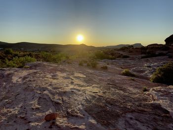 Scenic view of landscape against sky during sunset