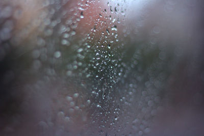 Full frame shot of raindrops on glass window