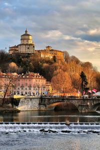 View of bridge over river in city