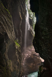 View of waterfall along rocks