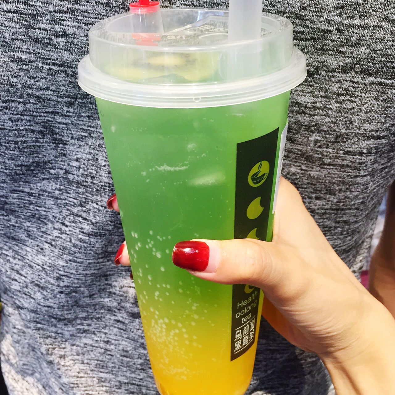 food and drink, human hand, real people, holding, one person, human body part, drink, freshness, green color, drinking straw, vegetable, close-up, healthy eating, food, day, outdoors, lifestyles, people