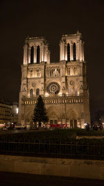 Low angle view of illuminated building at night