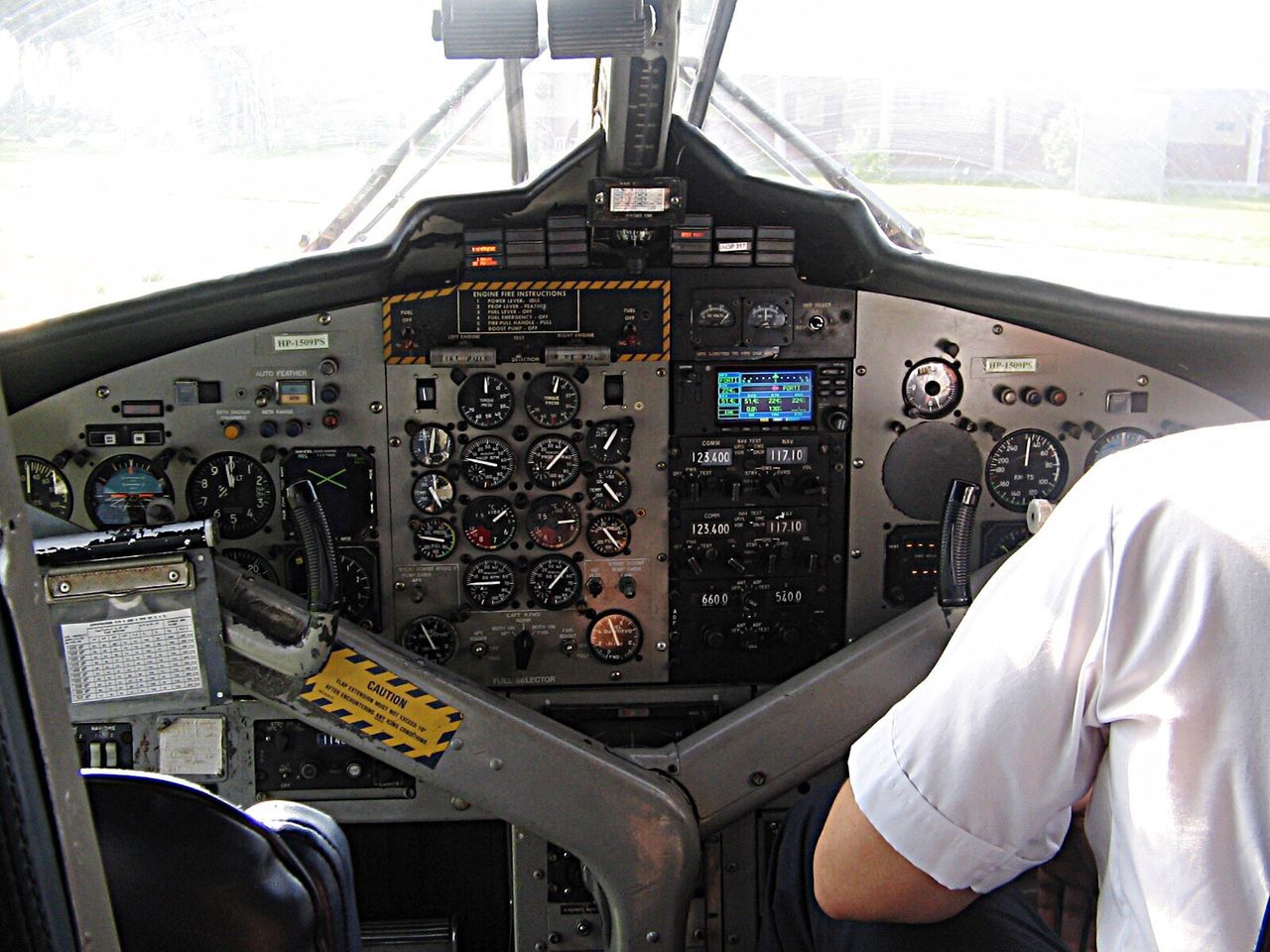 cockpit, airplane, air vehicle, transportation, pilot, aerospace industry, business finance and industry, vehicle interior, flying, control, skill, control panel, uniform, day, piloting, dashboard, co-pilot, no people