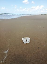 Flip-flops at sandy beach